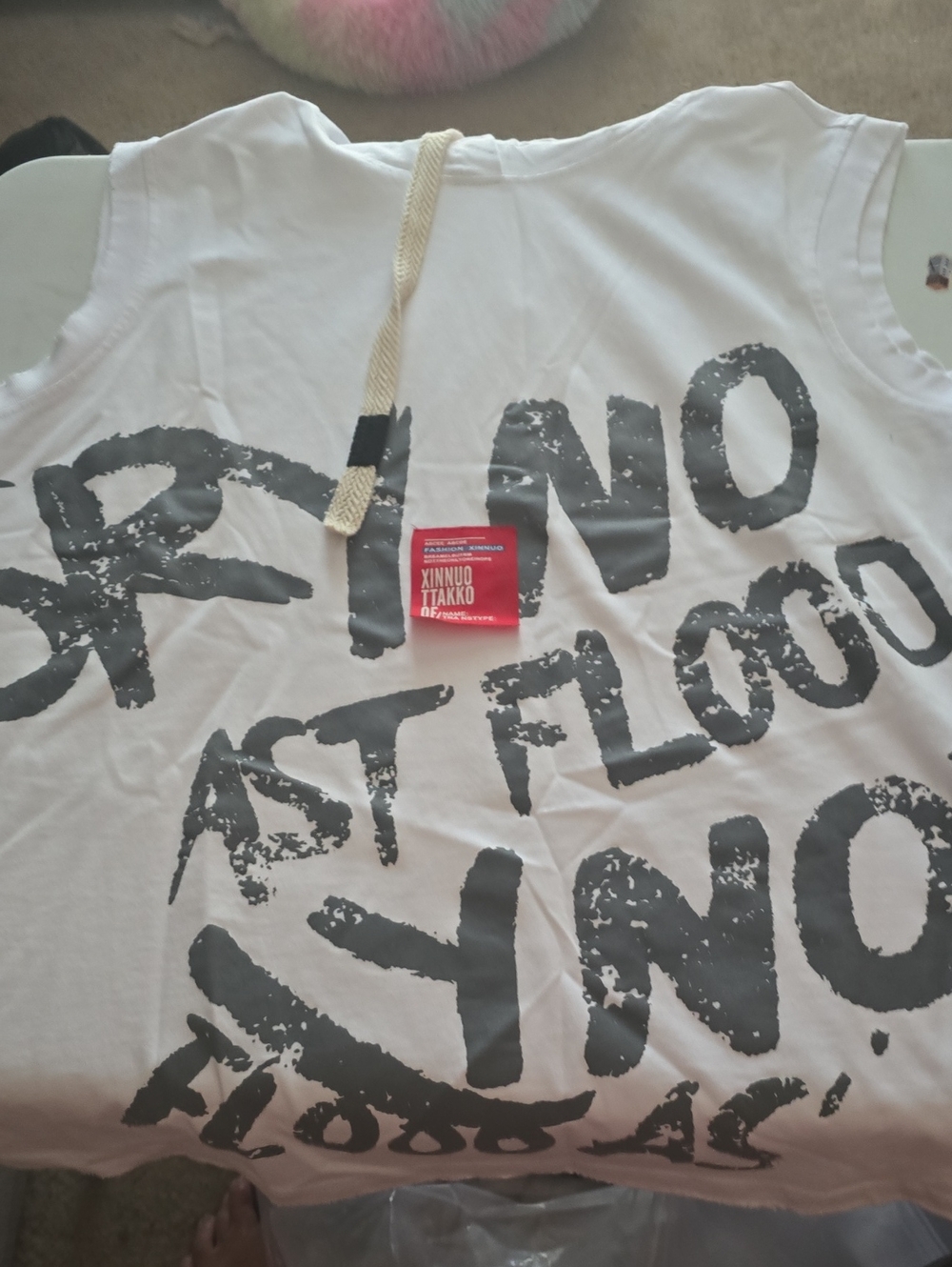 White Graphic Sleeveless Tee with Bold Black Text